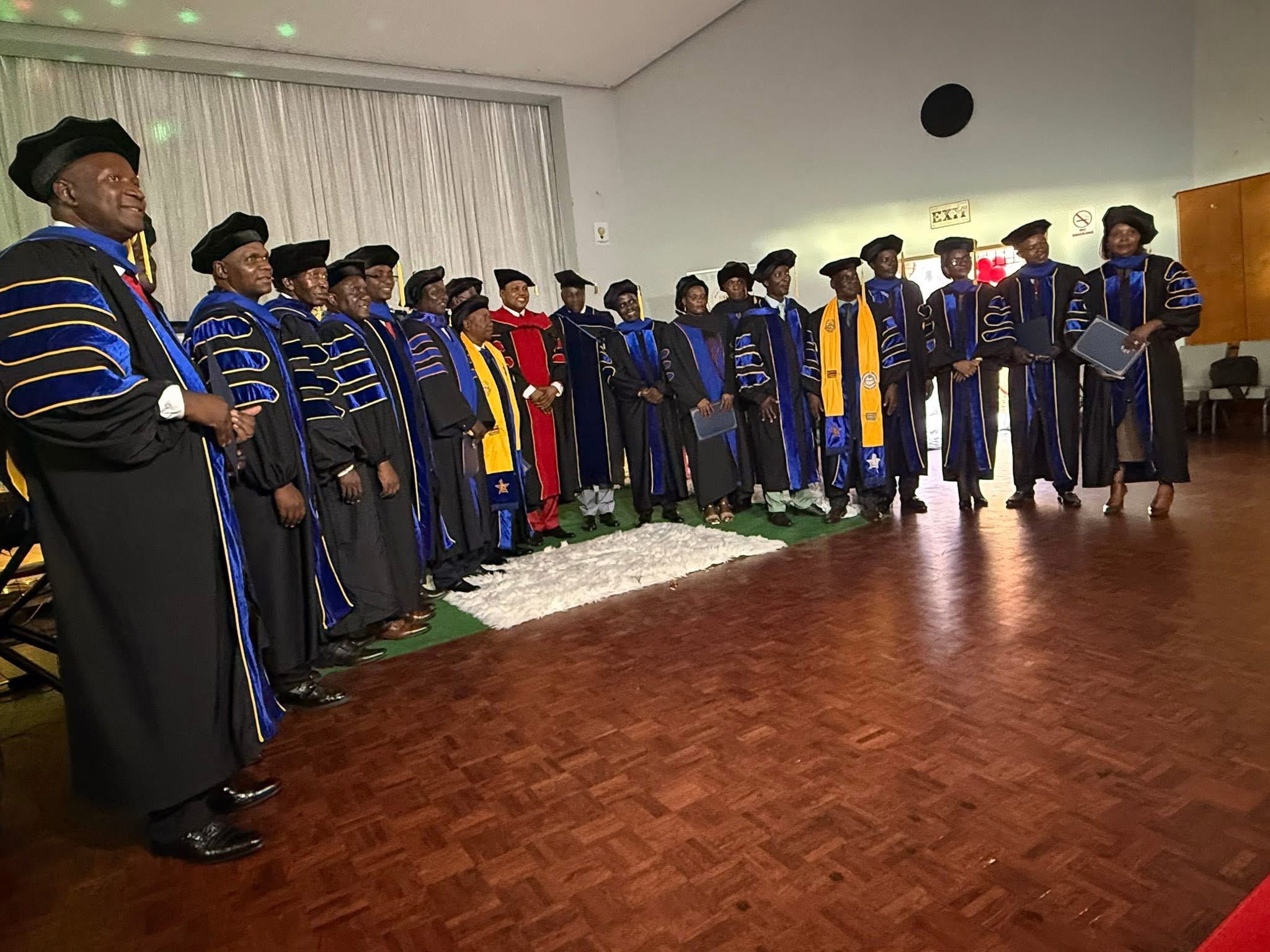 Graduates and faculty at commencement