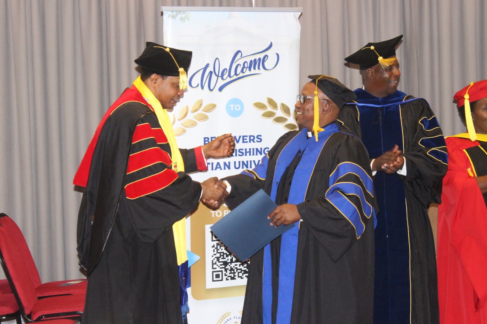 Chancellor greeting a graduate