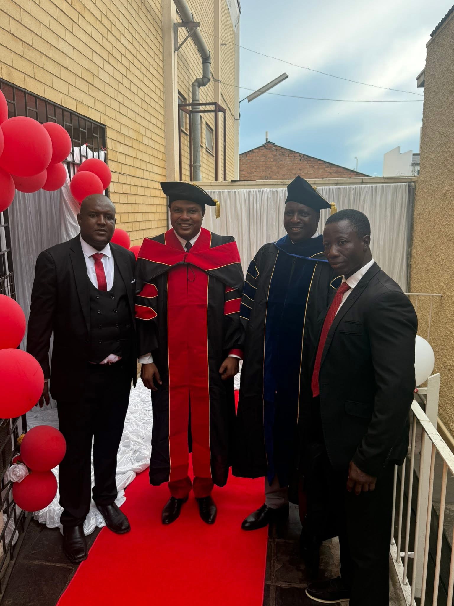 Faculty and graduates at the ceremony